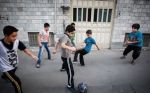 بازی فوتبال نوجوانان در یکی از خیابان های جنوبی شهر تهران